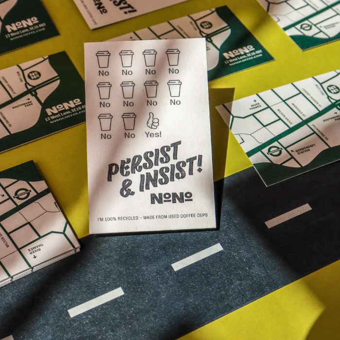 Business cards on kraft, coffee cup and seaweed stock